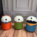 Caneca Dinosaurio Tapa Giratoria En La Cabeza 3 Colores 155X21Cm