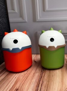 Caneca Dinosaurio Tapa Giratoria En La Cabeza 3 Colores 155X21Cm