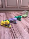 Grapadora en forma de dinosaurio pequeña